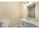 Clean bathroom with vanity sink, stylish mirror, and neutral paint at 2606 Landis Dr, Durham, NC 27705