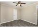 Light-filled bedroom featuring neutral walls, a ceiling fan, and sleek gray flooring at 2606 Landis Dr, Durham, NC 27705
