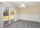 Dining room features hardwood-style floors, stylish lighting, and a sliding glass door leading to the backyard at 2606 Landis Dr, Durham, NC 27705
