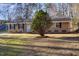 Ranch-style home with well-maintained landscaping and mature trees at 2606 Landis Dr, Durham, NC 27705