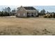 Exterior view of home with a large backyard and covered patio at 2609 Packhouse Rd, Zebulon, NC 27597