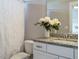 Bathroom featuring a granite countertop, a toilet, and a shower with a white curtain at 2609 Packhouse Rd, Zebulon, NC 27597