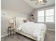 A cozy bedroom featuring a comfortable bed, neutral decor, and natural lighting at 2609 Packhouse Rd, Zebulon, NC 27597
