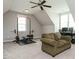 Finished bonus room features carpet, natural light, and is equipped as workout room and home office at 2609 Packhouse Rd, Zebulon, NC 27597