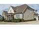 Beautiful two-story home with light brown siding, white trim, and manicured landscaping at 2609 Packhouse Rd, Zebulon, NC 27597