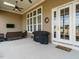 Covered outdoor patio featuring ample seating and a gas grill at 2609 Packhouse Rd, Zebulon, NC 27597