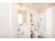 Well-lit bathroom with white vanity, mirror, tub-shower combo, and white fixtures at 272 Johnson Ridge Way, Four Oaks, NC 27524