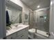Modern bathroom featuring a glass-enclosed shower, white vanity, and stylish fixtures at 272 Johnson Ridge Way, Four Oaks, NC 27524