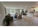 Open-concept layout showcasing the living room, dining area, and kitchen with stylish decor and plenty of natural light at 272 Johnson Ridge Way, Four Oaks, NC 27524