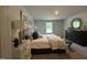 Serene bedroom featuring neutral tones, stylish furniture, and ample natural light at 272 Johnson Ridge Way, Four Oaks, NC 27524