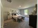 Serene bedroom featuring neutral tones, stylish furniture, and ample natural light at 272 Johnson Ridge Way, Four Oaks, NC 27524