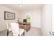 Dedicated home office space with desk, chairs, and natural light from the window at 272 Johnson Ridge Way, Four Oaks, NC 27524