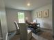 Office space featuring a window, modern desk, and stylish decor at 272 Johnson Ridge Way, Four Oaks, NC 27524