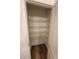 Walk-in closet with wire shelving and wood-look floors at 28 Longdale Dr, Graham, NC 27253