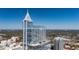 Stunning aerial view of a high-rise building with modern architecture and a clear blue sky backdrop at 301 Fayetteville St # 3205, Raleigh, NC 27601