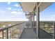 Spacious condo balcony with sleek railing and glass doors offers panoramic city views at 301 Fayetteville St # 3205, Raleigh, NC 27601