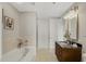 This bathroom has a granite-top vanity, bathtub, and a tiled shower with glass doors at 301 Fayetteville St # 3205, Raleigh, NC 27601