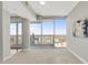 Sunlit bedroom with expansive windows and a balcony that provides stunning city views at 301 Fayetteville St # 3205, Raleigh, NC 27601