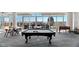 The game room boasts a pool table with outdoor dining on the terrace at 301 Fayetteville St # 3205, Raleigh, NC 27601