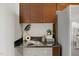 Kitchen detail with granite countertop and stainless steel appliances at 301 Fayetteville St # 3205, Raleigh, NC 27601