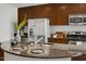Close up on island with granite countertops and stainless steel sink in gourmet kitchen at 301 Fayetteville St # 3205, Raleigh, NC 27601