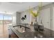Kitchen island with granite countertops and stylish decorations with hardwood floors at 301 Fayetteville St # 3205, Raleigh, NC 27601
