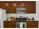 Modern kitchen with stainless steel appliances and granite countertops with cabinetry at 301 Fayetteville St # 3205, Raleigh, NC 27601