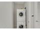 Efficient laundry closet features stacked washer and dryer for space-saving convenience at 301 Fayetteville St # 3205, Raleigh, NC 27601
