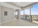 Bright living room with neutral tones, floor-to-ceiling windows, and a city view balcony at 301 Fayetteville St # 3205, Raleigh, NC 27601