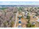 An aerial view of the property and surrounding neighborhood at 307 S Main St, Four Oaks, NC 27524