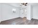 Bright bedroom features a ceiling fan and sliding barn door to an attached bathroom at 307 S Main St, Four Oaks, NC 27524
