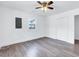 Bedroom features wood-look flooring, a window, and a closet at 307 S Main St, Four Oaks, NC 27524