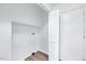A storage area features a bifold door and connections for a washer and dryer at 307 S Main St, Four Oaks, NC 27524