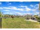 Large backyard with a lush lawn, a patio seating area with an umbrella, and a wood privacy fence at 310 Mineral Spring Ln, Fuquay Varina, NC 27526