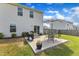 Backyard with patio featuring outdoor dining set and BBQ, ideal for enjoying outdoor meals and gatherings at 310 Mineral Spring Ln, Fuquay Varina, NC 27526