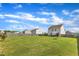 Vast backyard with a privacy fence, manicured lawn, and patio set for outdoor enjoyment at 310 Mineral Spring Ln, Fuquay Varina, NC 27526