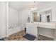 Bathroom featuring a double vanity, large mirror, and shower-tub combination, with neutral colors and tile flooring at 310 Mineral Spring Ln, Fuquay Varina, NC 27526
