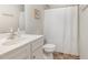 The bathroom features a classic vanity and ample lighting, with a shower curtain at 310 Mineral Spring Ln, Fuquay Varina, NC 27526