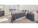 Comfortable bedroom with plush carpeting, soft lighting, a large window, and tasteful furnishings at 310 Mineral Spring Ln, Fuquay Varina, NC 27526