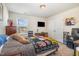 Cozy bedroom is staged with stylish decor, offering a comfortable and inviting personal space at 310 Mineral Spring Ln, Fuquay Varina, NC 27526