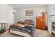 Bright bedroom with a quilt, dresser, and closet at 310 Mineral Spring Ln, Fuquay Varina, NC 27526