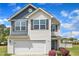 Attractive two-story home showcasing well-kept landscaping and an attached two-car garage at 310 Mineral Spring Ln, Fuquay Varina, NC 27526