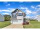 Charming two-story home featuring white siding, a front-facing garage, and well-manicured landscaping at 310 Mineral Spring Ln, Fuquay Varina, NC 27526