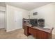 The office features a large wooden desk and neutral walls with carpet flooring at 310 Mineral Spring Ln, Fuquay Varina, NC 27526