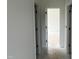 Hallway showcasing white walls and doors, leading to other rooms at 3213 Emeline Way # 14, Fuquay Varina, NC 27526