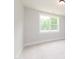 Bright bedroom featuring a large window with a view of lush greenery at 4225 Burlington Mills Rd, Wake Forest, NC 27587