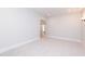 Spacious bedroom with plush carpeting, neutral paint, recessed lighting, and an open doorway at 4225 Burlington Mills Rd, Wake Forest, NC 27587