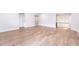 Open-concept living room with hardwood flooring, neutral walls, and lots of natural light at 4225 Burlington Mills Rd, Wake Forest, NC 27587