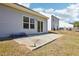 Backyard featuring a patio, large window, sliding glass door, and a lawn at 425 Legacy Dr, Youngsville, NC 27596