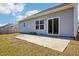 Backyard featuring a patio, large window, and sliding glass door at 425 Legacy Dr, Youngsville, NC 27596